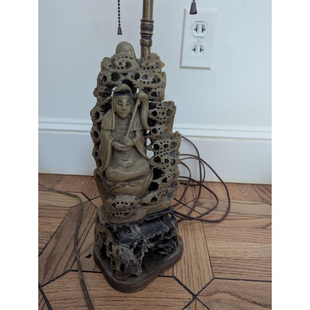 Antique Chinese lamp. Appears to be carved soapstone. Likely depicting the goddess Guanyin or an immortal. Greenish brown...