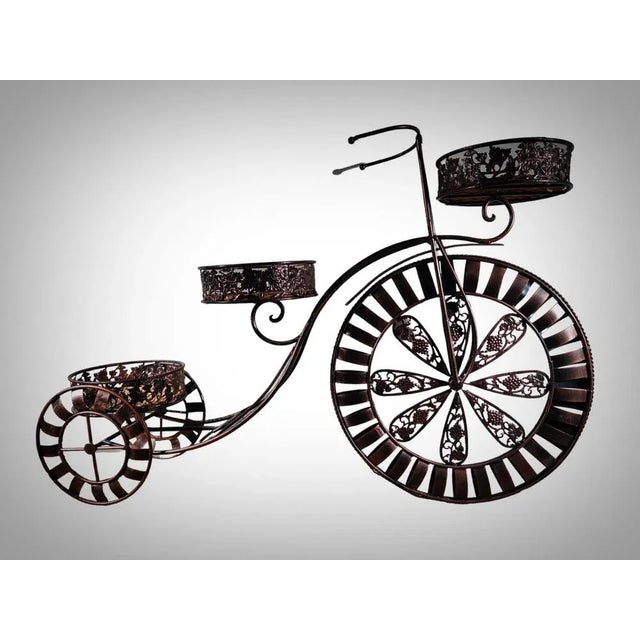 50s Flower Pot Decorative flowerpot from the 50s in the shape of a bicycle. In patinated iron. In good condition....