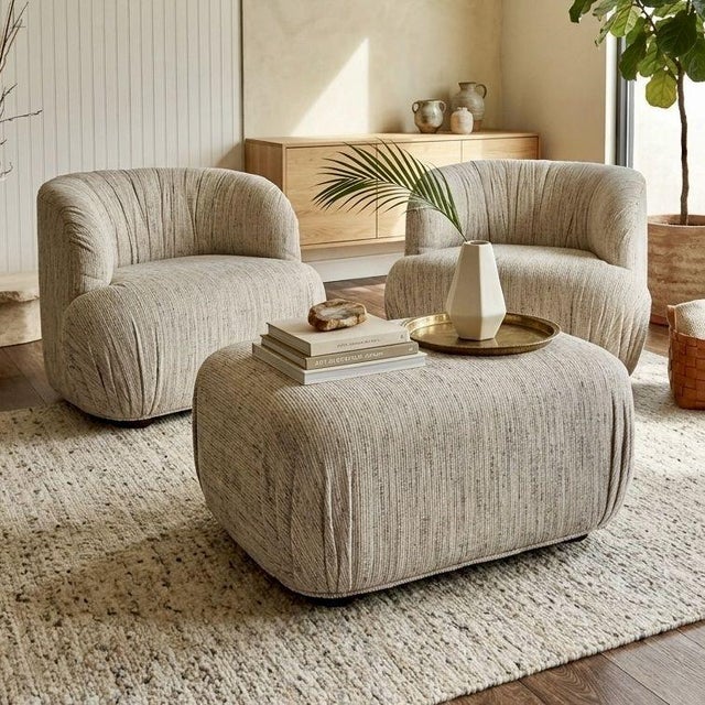 Sculptural modern lounge chair set with matching ottoman. Features oversized curved silhouette, clean “confetti” tweed...