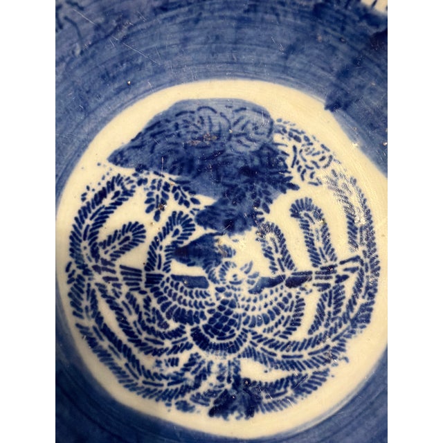 Dark blue and white mid century Japanese Kagami bowl. Bowl is free of defects. The bottom ring around the base has some...
