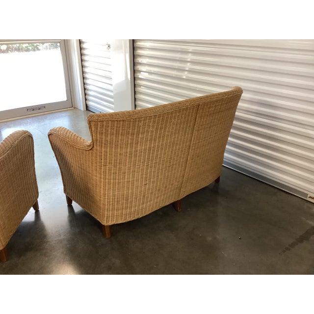 This wicker love seat is the perfect size for a porch or family room. The high back and sloping sides adds elegance and...