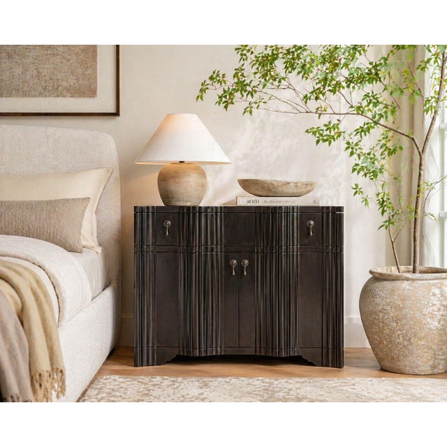 A striking pair of sculptural nightstands attributed to OLY Studio, showcasing the brand’s signature blend of modern...