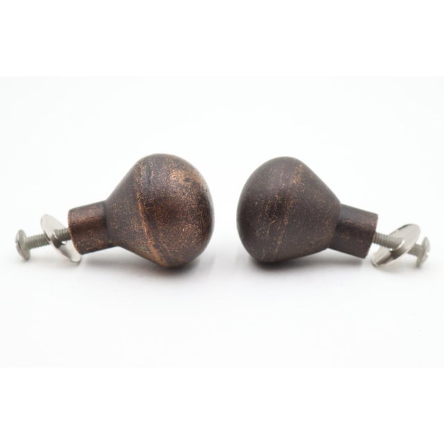 Rustic style ball shaped cabinet or drawer knobs made of bronze with a distressed dark finish. Mounting screws are...