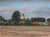 The Old Church by Michael DeVore | Oil on panel Landscape with a church and surrounding fields. For Sale