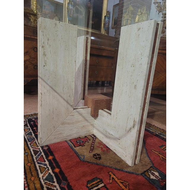 Dining table with glass top measuring 140 x 140 cm, from the 1970s, beautiful travertine base with insertion of red...