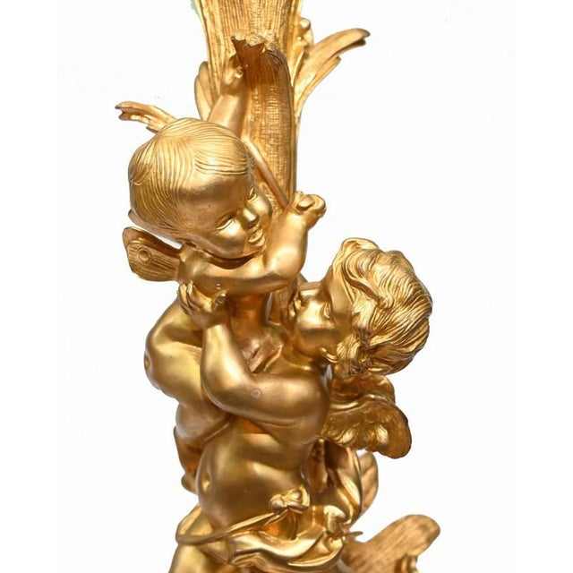 Stunning pair of large gilt and marble candelabras in the Clodion manner Good size at just under three feet tall So eye...