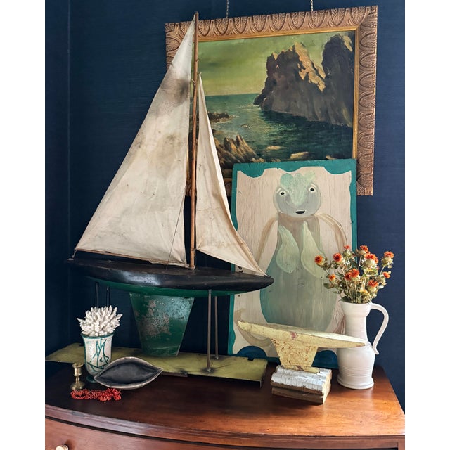 A monumental and rare antique pond boat — an impressive 45" tall model yacht (with original sails) mounted on a folk-art...