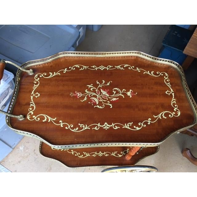 Probably from the 1960s, this is a very nice rolling bar cart in the style of the Hollywood Regency, having the Italian...