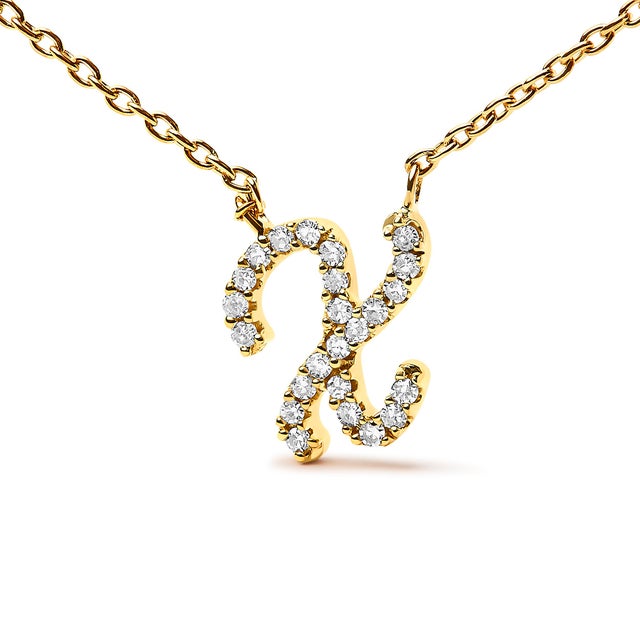 Embrace the elegance of personalization with this stunning 10K Yellow gold pendant, delicately crafted into a flowing...