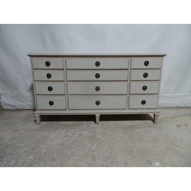 This is a Rare Gustavian Style 12 drawer dresser. it was restored and repainted with Milk Paints "Oyster White"