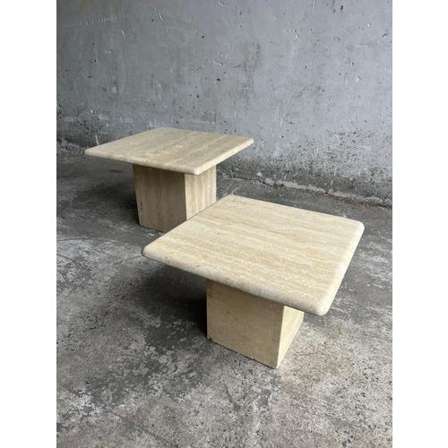 Set of two vintage travertine nesting side tables from italy, 1970s. Solid stone construction with natural beige tones and...
