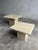 Set of two vintage travertine nesting side tables from italy, 1970s. Solid stone construction with natural beige tones and...