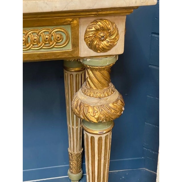 The 18th c Italian Neoclassical Parcel Gilt Console is a stunning piece of antique furniture that exudes elegance and...