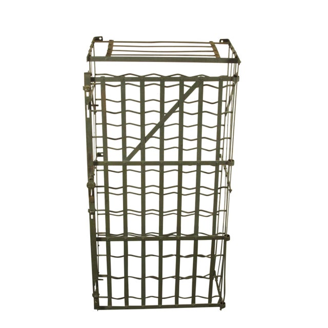 An early 20th-C. French wrought iron wine rack by Rigidex. Features a lockable hasp and a capacity of 50 bottles. Mounts...