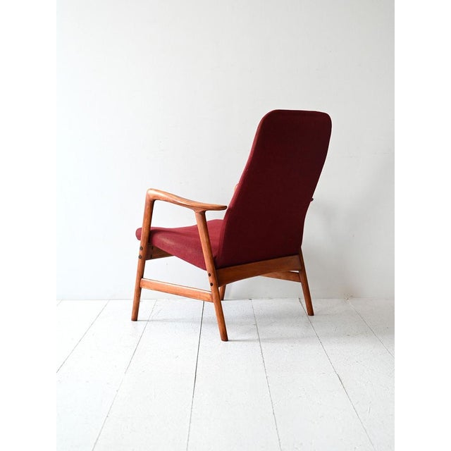 1960s armchair by Ljungs Industrier AB, solid wood frame and original wine-colored upholstery with Studio label. Vintage...