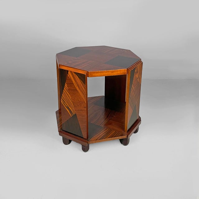 Coffee table with double hexagonal top, made entirely of wood in different colors. The structure is composed of four...