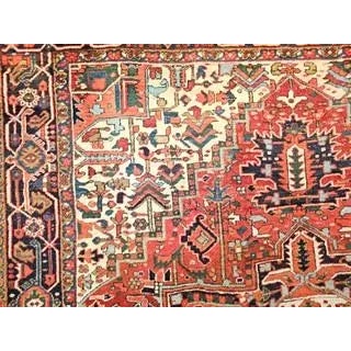 Beautiful and very colorful vintage Persian Heriz room size rug from the first quarter of the 20th century. The field is a...