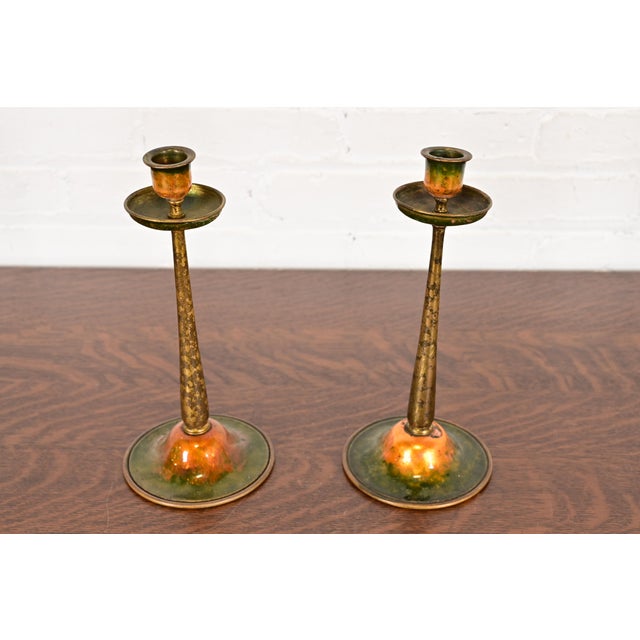 A gorgeous pair of Arts & Crafts or Art Deco period bronze and enameled candlesticks By Louis Comfort Tiffany Furnaces,...