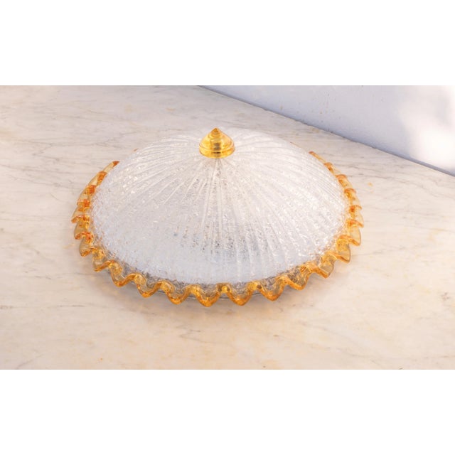 Stunning orange and transparent/silver Murano ceiling light. The ceiling light consists of two glass elements, the central...