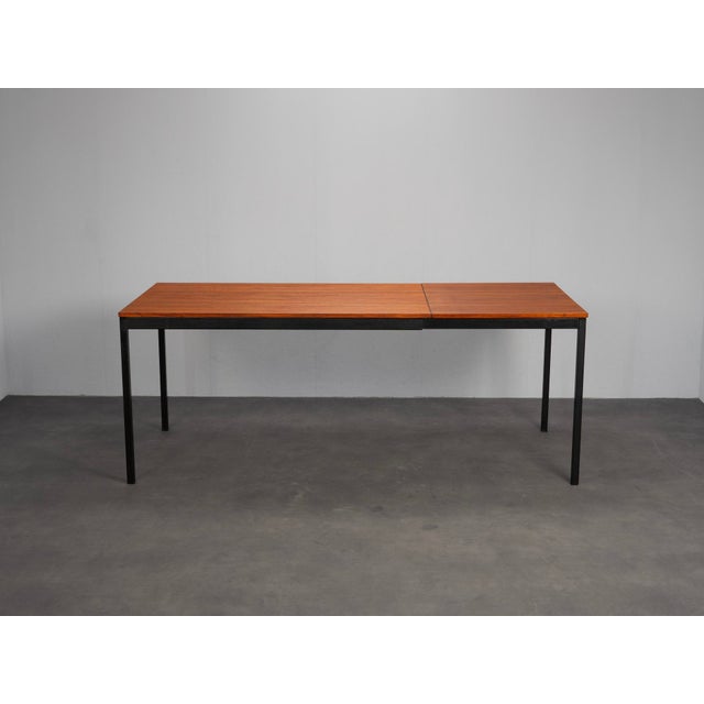 A refined extendable dining table by gispen, model 3707, produced in the netherlands during the 1960s. The design combines...