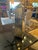 Pair of Venetian-styled Mirrored Obelisks on rusticated wood made to look like metal raised platforms. The mirrors have a...