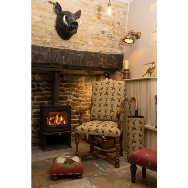 Tapestry Footstools with bun-feet and traditional-style studding.