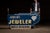 Double-sided projecting neon trade sign reading "Johnson's Jeweler - Watch Repairing" with secondary "Loyalty" diamond...