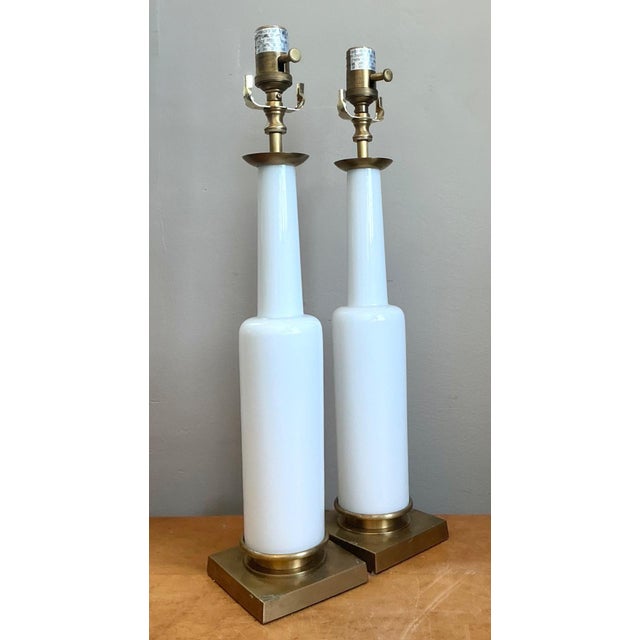 This sophisticated pair of Mid-Century Modern table lamps exemplifies the era's dedication to sleek, minimalist...