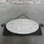 This faceted mirror has some age spots. Height: 34 cm (excluding chain). Width: 76 cm. Depth: 3 cm. Origin: France, 1933....