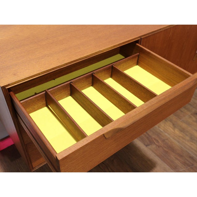 Discover timeless elegance with our Mid Century Modern Vintage Teak Sideboard Credenza by Mcintosh at Mid Century Traders....