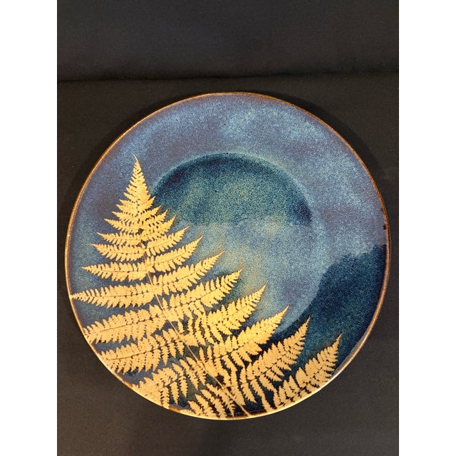 This handmade collection of stoneware plates and platter with a fern design are by Kaleidoscope Pottery. Each piece is...