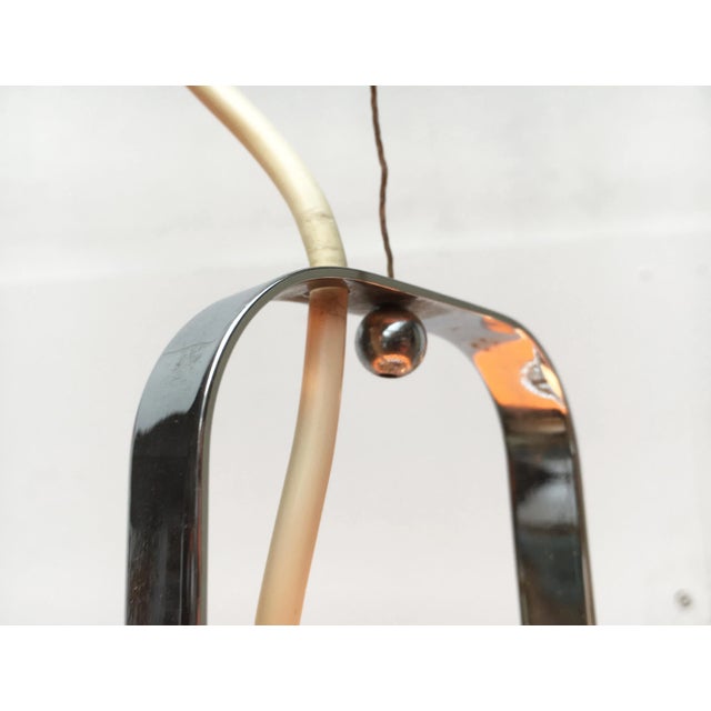 Pendant lamp by Guzzini based on a design by Luigi Massoni from the 60s. The characteristic plastic shade is made in...