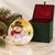 Beautiful vintage glass Christmas ornament featuring a whimsical hand-painted snowman against an iridescent golden winter...