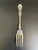 Antique cold meat serving fork in the Floral pattern by Wallace Silver. This exquisite piece features an elaborate design...