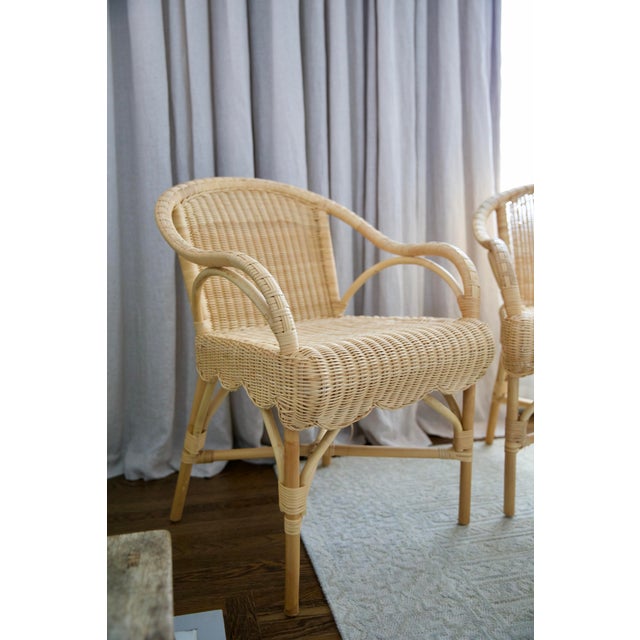 32 inches high x 23 inches wide x 24.25 inches deep Constructed from rattan Finished in natural Features a 1920s French-...