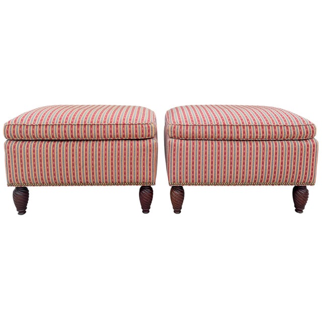 Pair of upholstered ottomans by O. Henry House of High Point, North Carolina. These feature richly turned spiral legs in a...