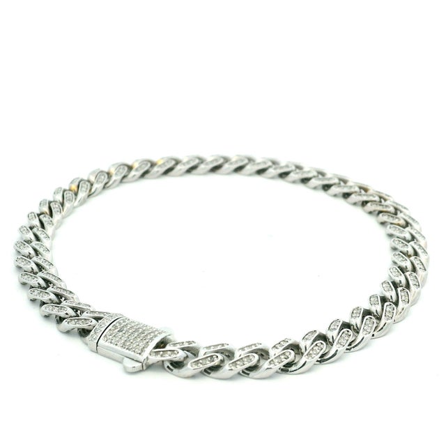 A bold diamond pavé link bracelet crafted in 14 karat white gold and set with approximately 6.50 carats of round...