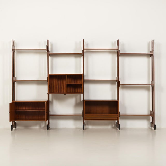 This impressive italian freestanding wall unit comes from the 1970s and, by the architectural character, resembles gio...