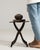 This piece presents as a candle holder/stand, distinguished by dark wrought iron, tripod X-form base. Originating in...