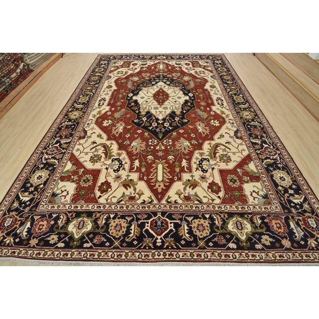 This traditional tribal Ziegler rug is hand-knotted with an all-wool pile on a cotton foundation. This rug is new and in...