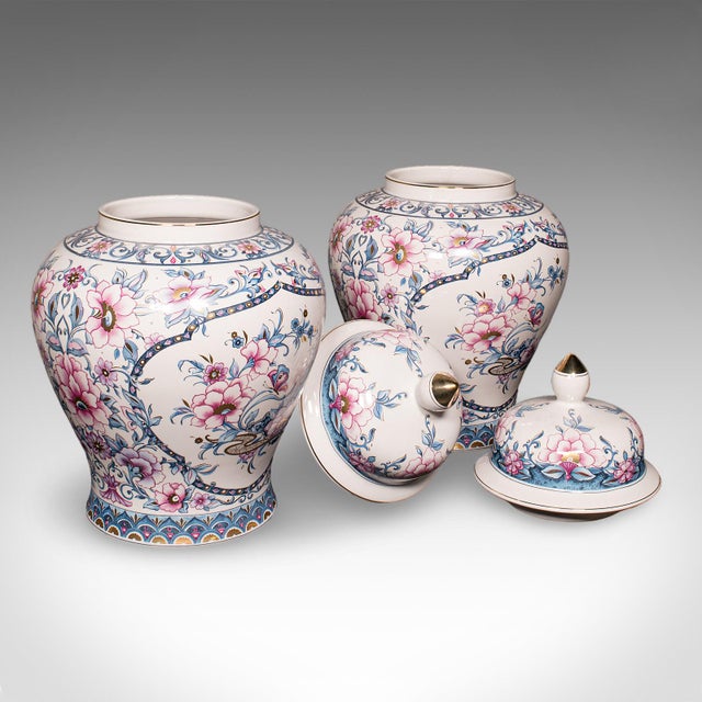 This is a large pair of vintage display vases. An Italian, ceramic and gilt finished baluster urn, dating to the late 20th...