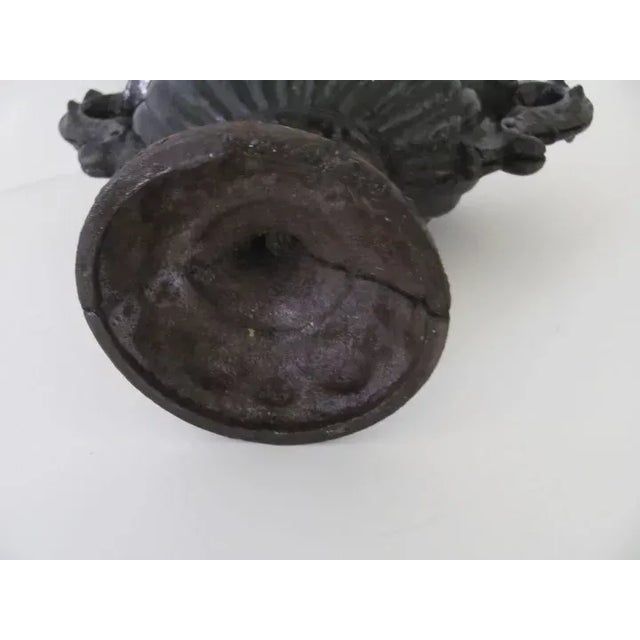 American cast iron painted black footed urn. Rare small size. c 1890 11" by 8 1/2"