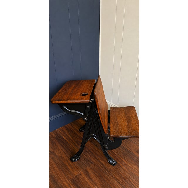 Such a cool statement piece! Beautiful vintage/antique schoolhouse desk with attached seat, featuring warm richly grained...