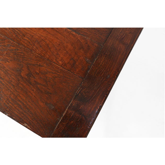 This French antique rustic dark oak table is the perfect addition to any modern living space or interior style. Crafted...