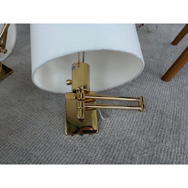 Handsome set of Hinson solid Brass swing arm sconces. Originally designed by George Hansen in the 1940s and later bought...