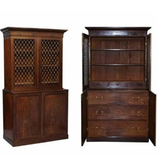 Victorian mahogany with bronzed gold gilding pierced metal work doors and fittings bookcase sitting on a large chest of...