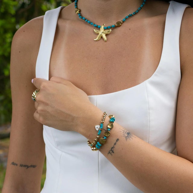 Find balance, beauty, and spiritual calm with the Inner Peace Turquoise & Heart Charm Gold Bracelet Set. This handmade...