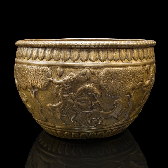 This is an antique offering bowl as planter. A South East Asian, brass relief jardiniere pot, dating to the late Victorian...