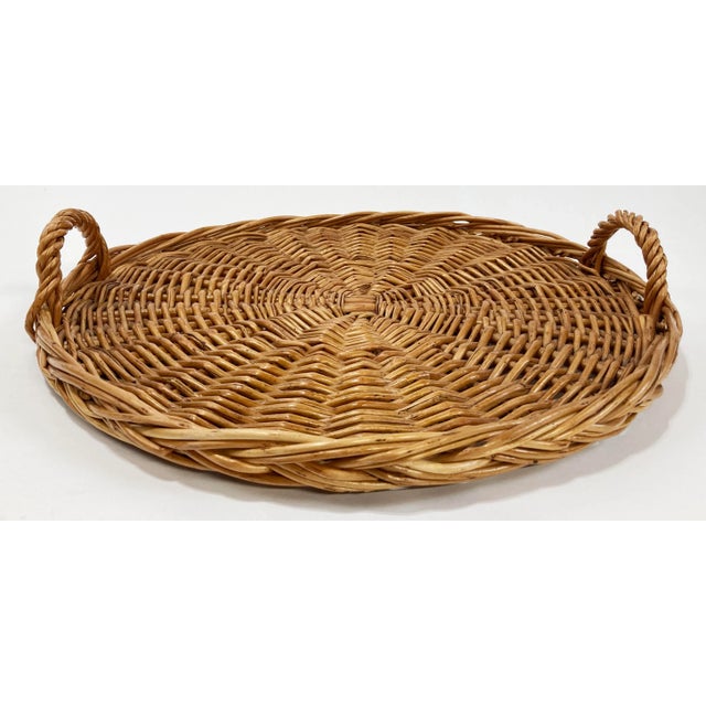 Vintage flat round woven wrapped rattan tray with side handles. Age wear. Solid sturdy structure.