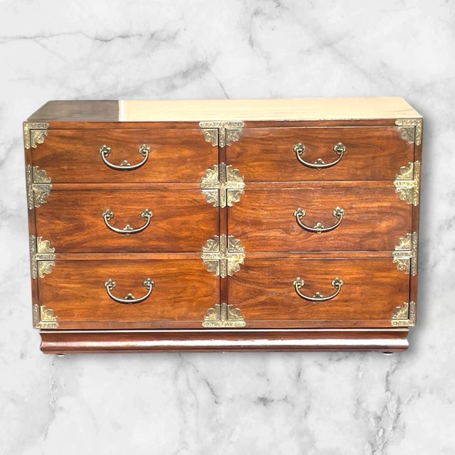 A beautiful and not found too often 6 drawer low chinoiserie low dresser . Made of walnut with brass mounts. Henredon...